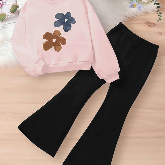 Trendy two-piece floral top set for girls on a wooden background.