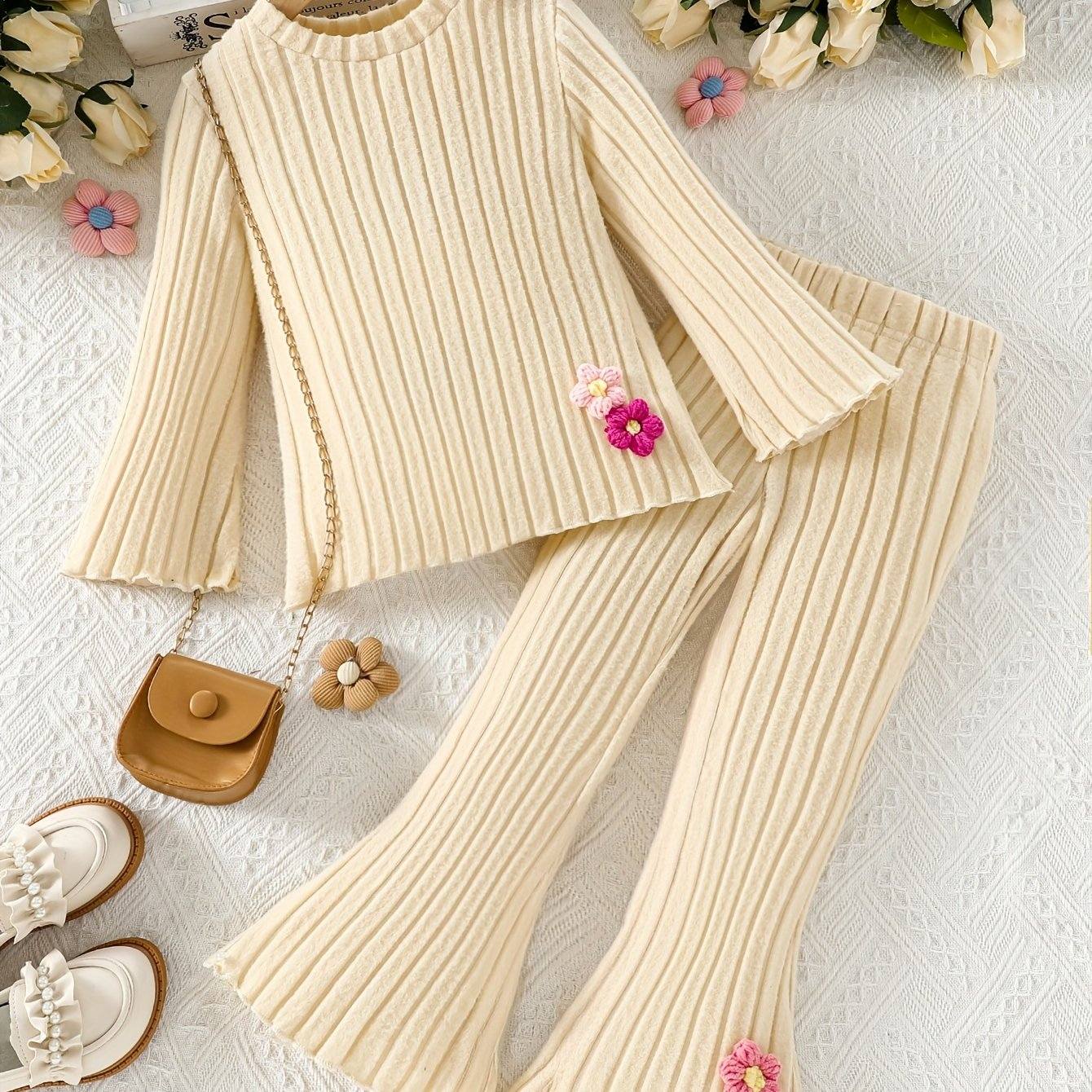 Stylish girls' outfit set in cream, featuring a ribbed top and pants with floral accents, ideal for both casual and formal occasions.