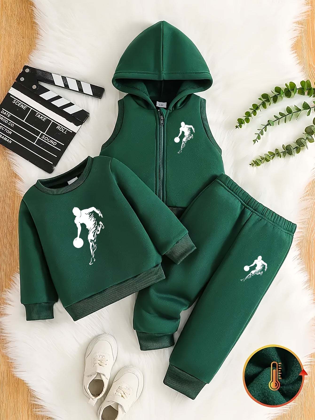 Sporty three-piece boys set with soccer player design on hoodie, sweatshirt, and pants.