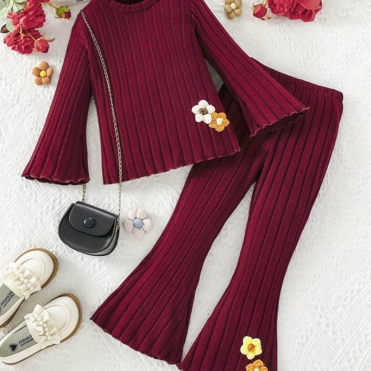Stylish girls' outfit set in burgundy, featuring a cozy knit fabric with elegant details for a chic look.