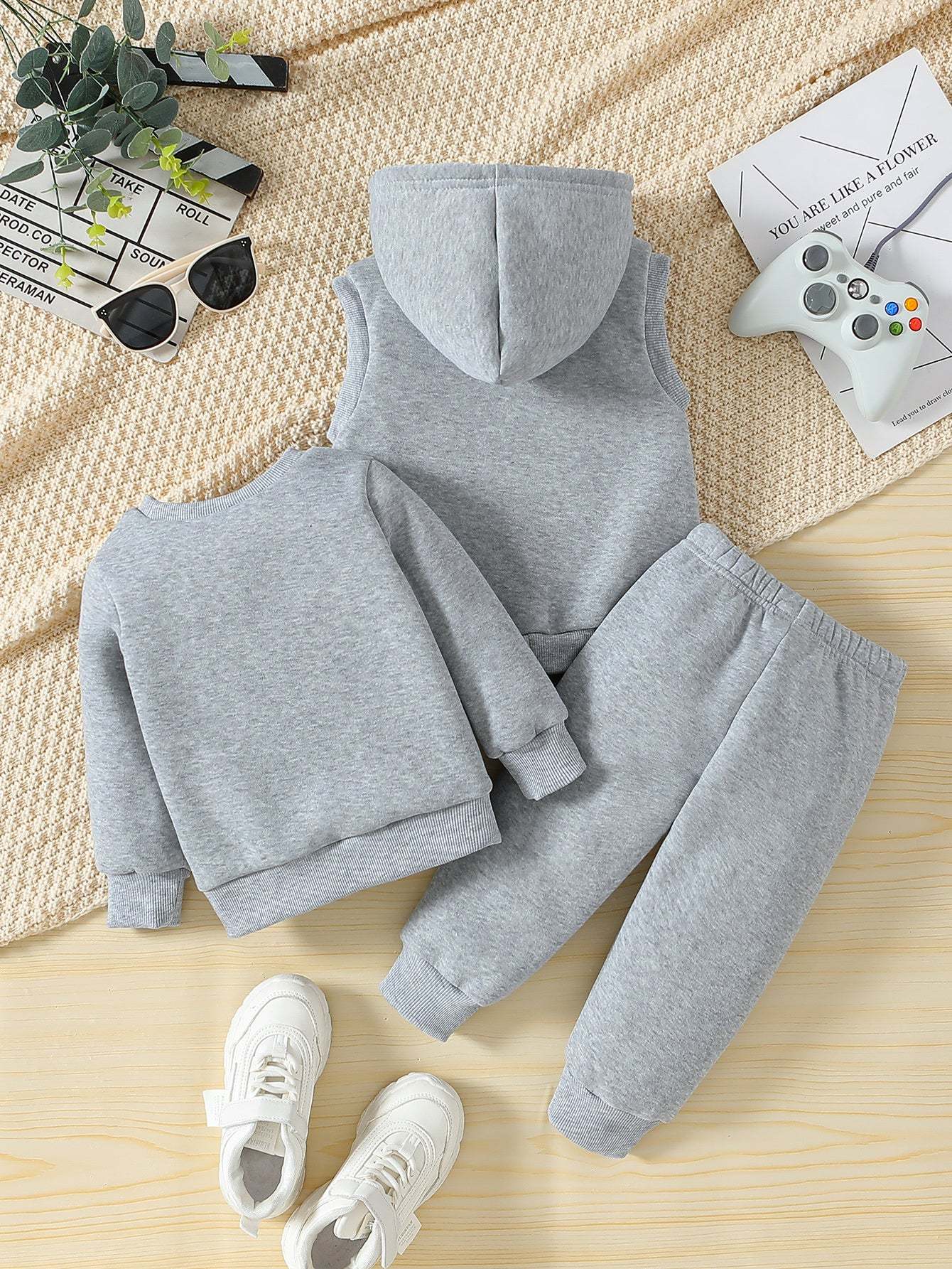 Sporty three-piece set for boys with soccer player design, featuring comfortable knit fabric and versatile style.