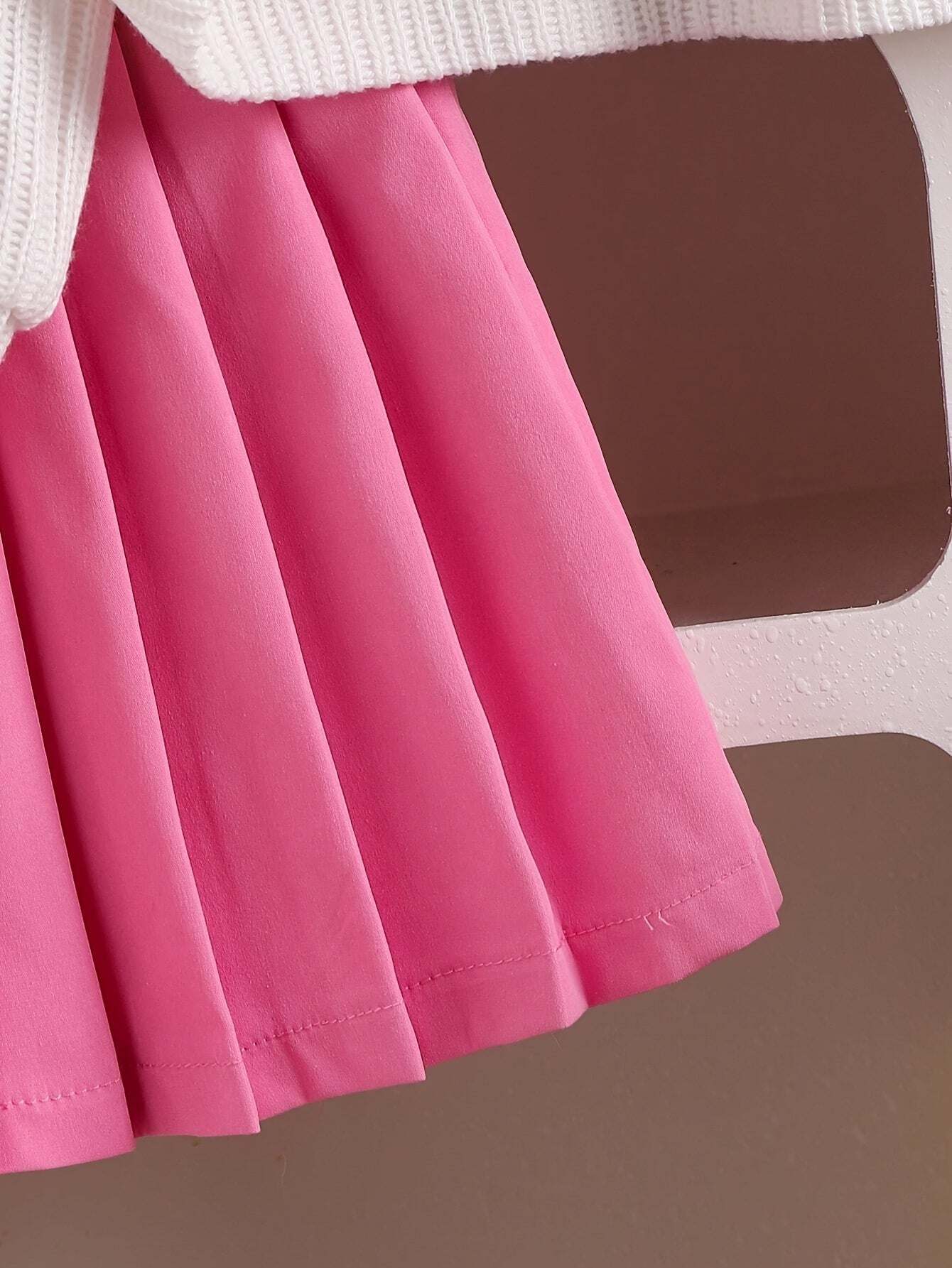 Adorable girls' outfit set with cute pink skirt and white top.