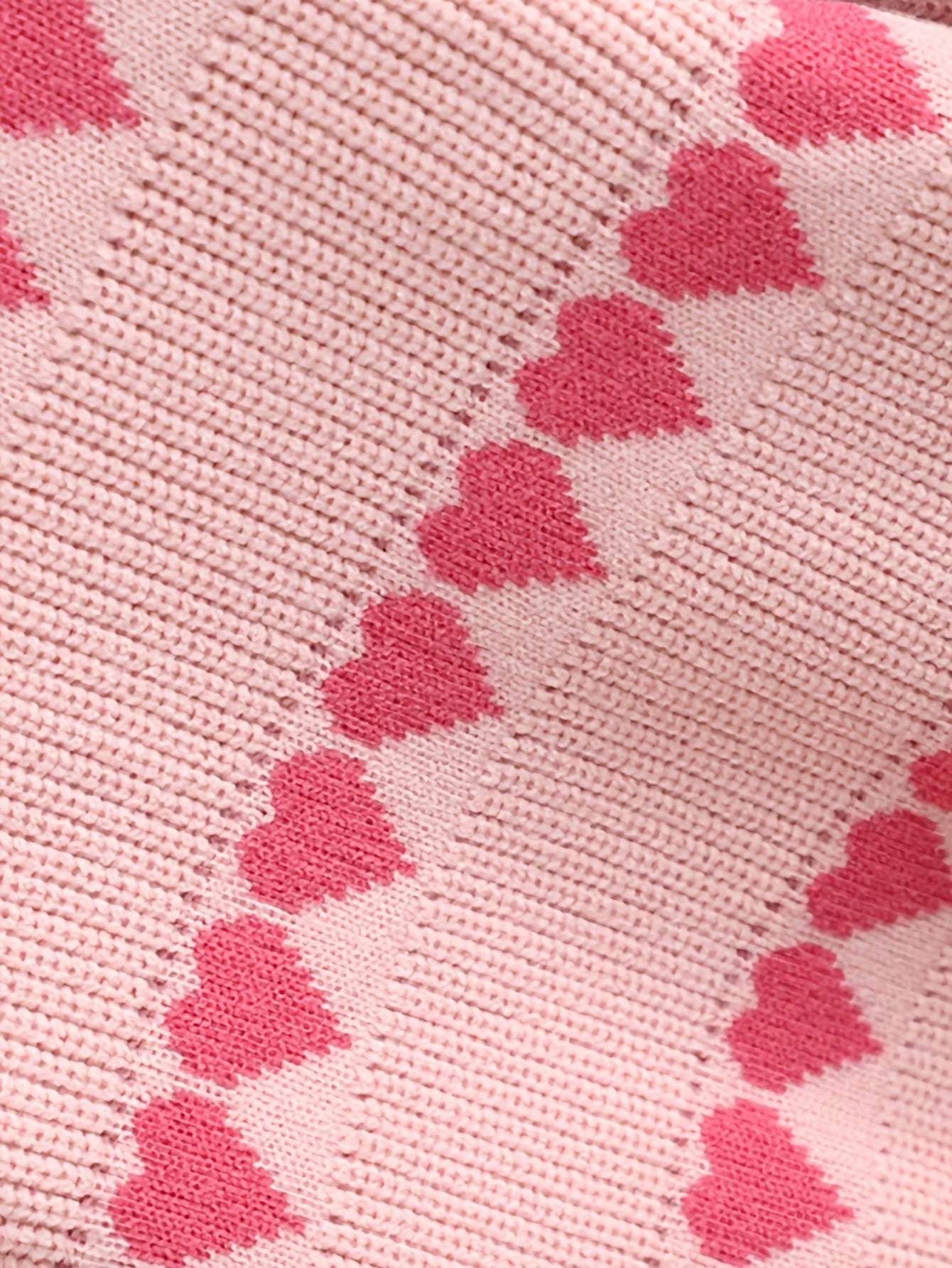 Adorable heart-patterned cotton fabric for kids' clothing set.