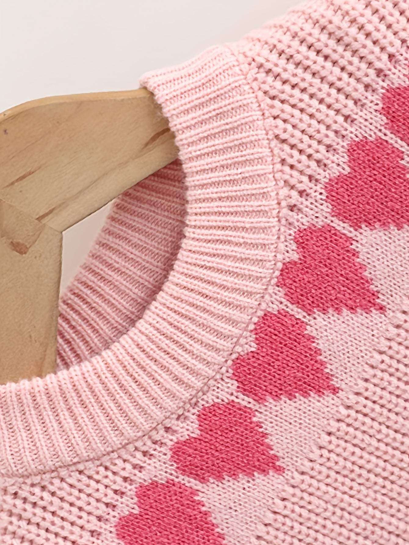 Adorable heart-patterned knit fabric for kids' clothing set.