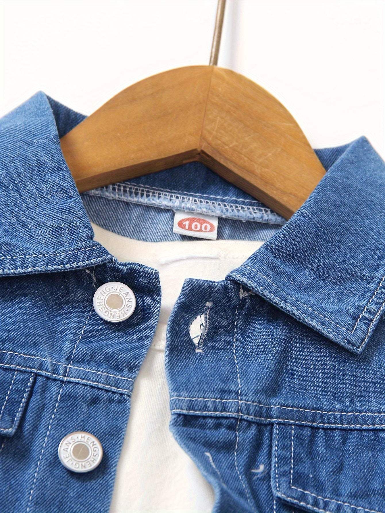 Cool boys' denim outfit set on hanger showcasing durable fabric.