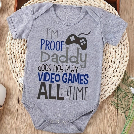 Infant romper with humorous message "I'm Proof Daddy Does Not Play Video Games All the Time" in playful design.