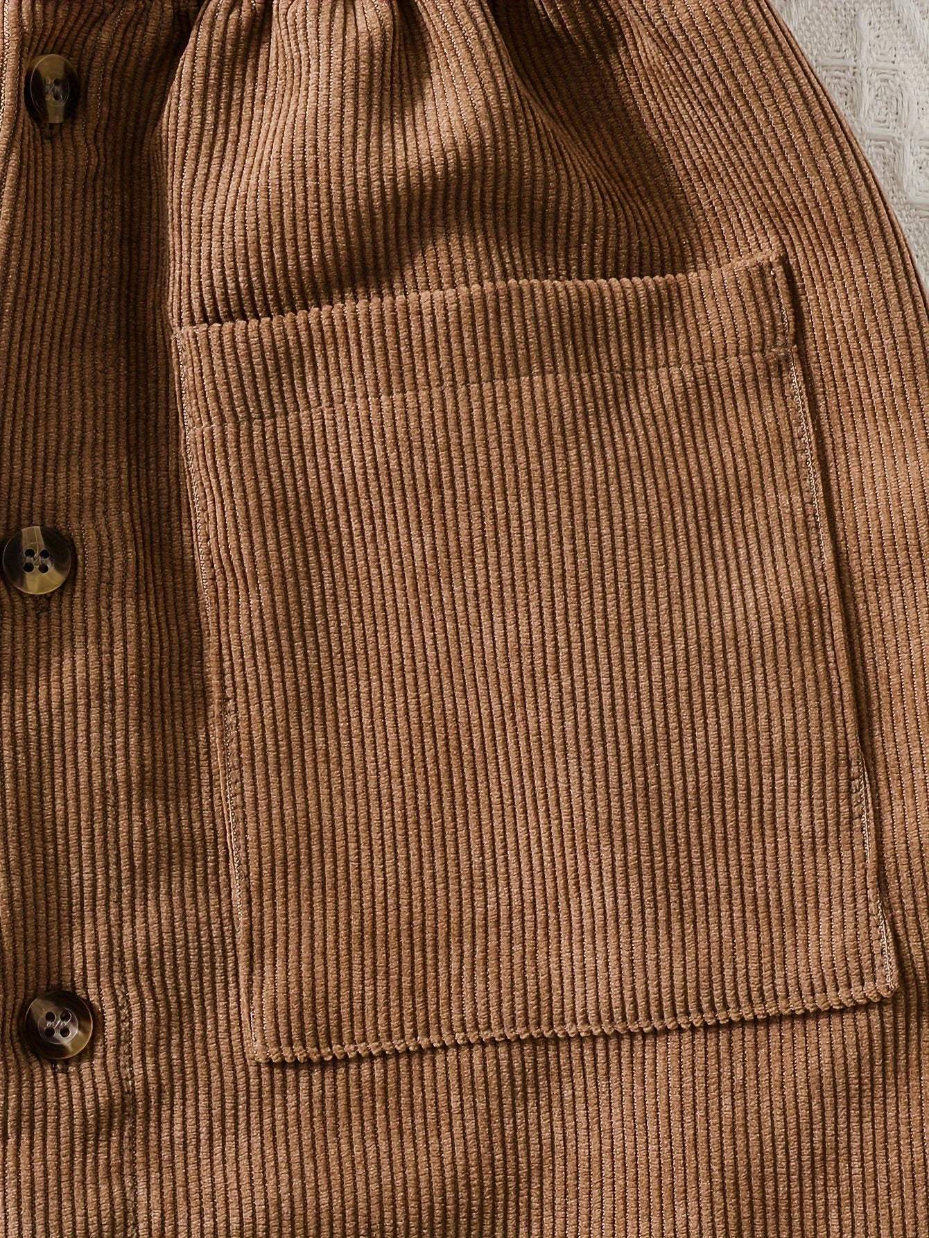 Close-up of a brown ribbed fabric with a pocket, part of a fashionable two-piece dress collection.