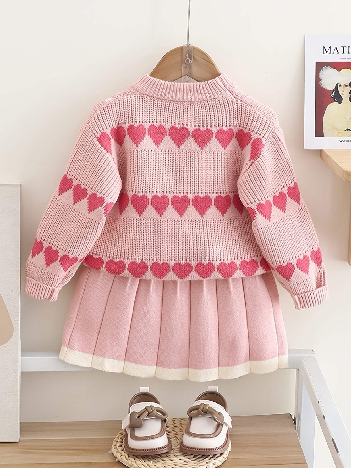 Adorable heart-patterned kids' cotton set with pleated skirt and sweater.