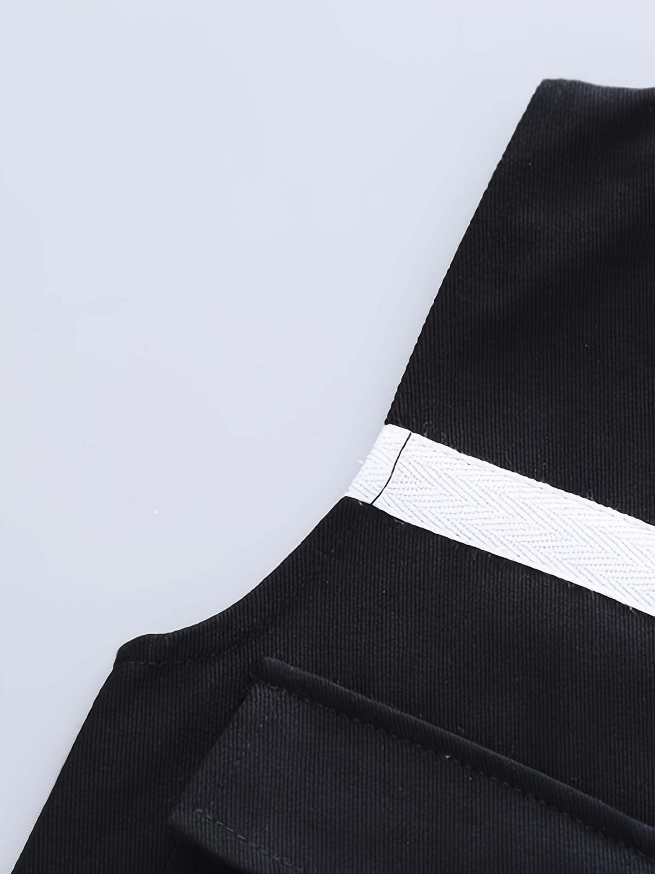 Close-up of trendy boys' three-piece set featuring bold 'Boy' design with high-quality cotton fabric.