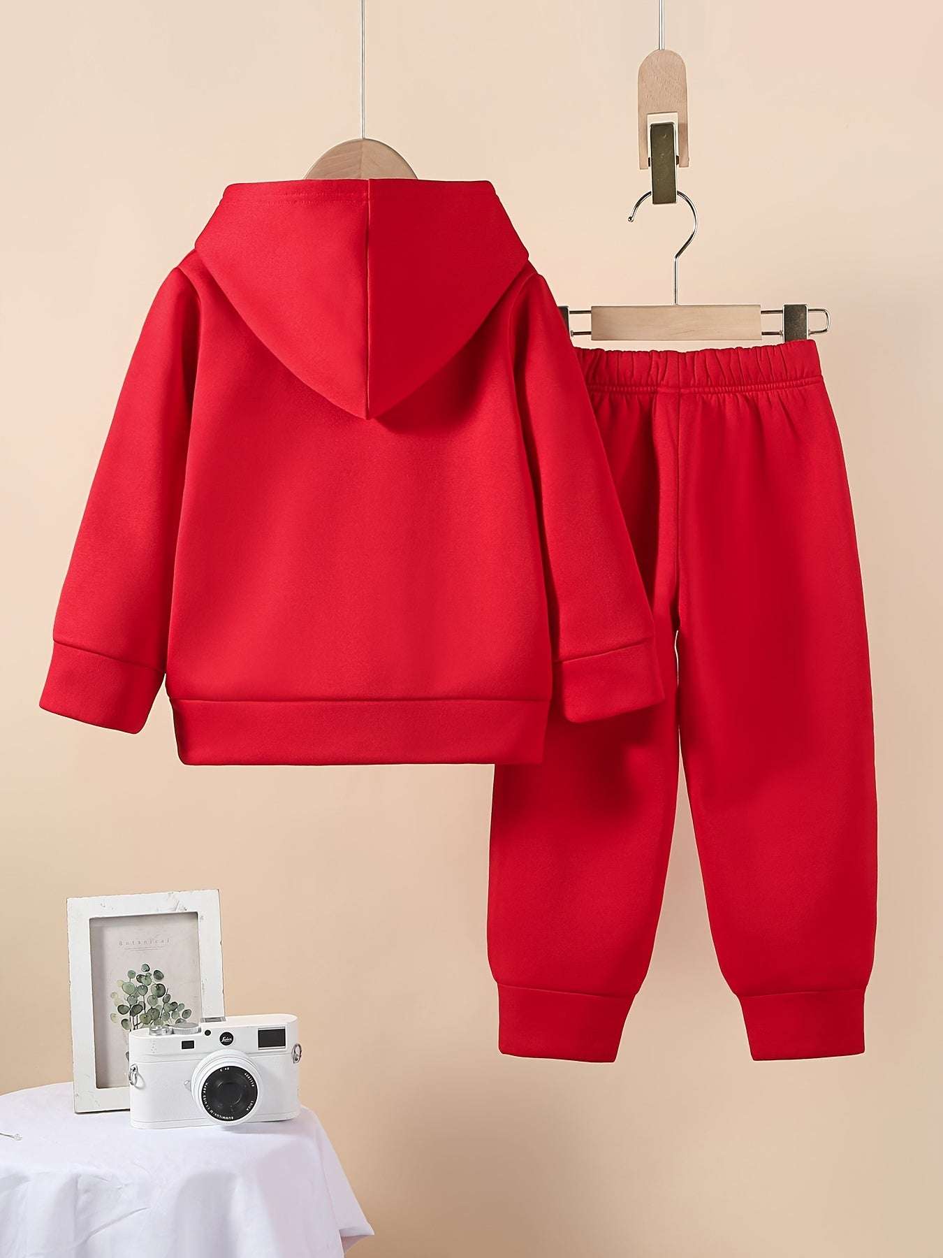 Stylish boys' red Milano set featuring a hoodie and matching pants, made from premium polyester.