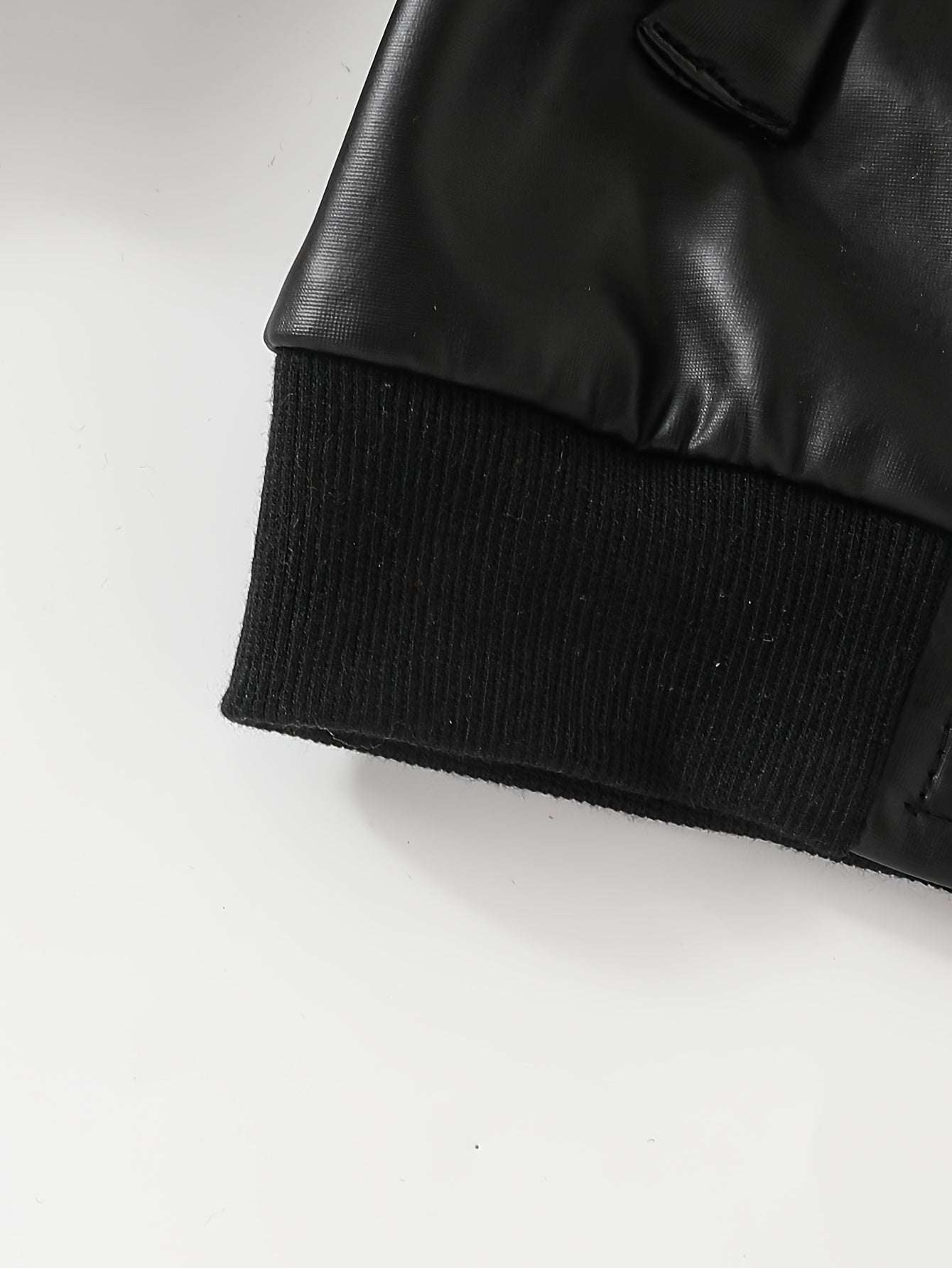 Black classic leather jacket for boys with ribbed cuffs, showcasing stylish and durable design.