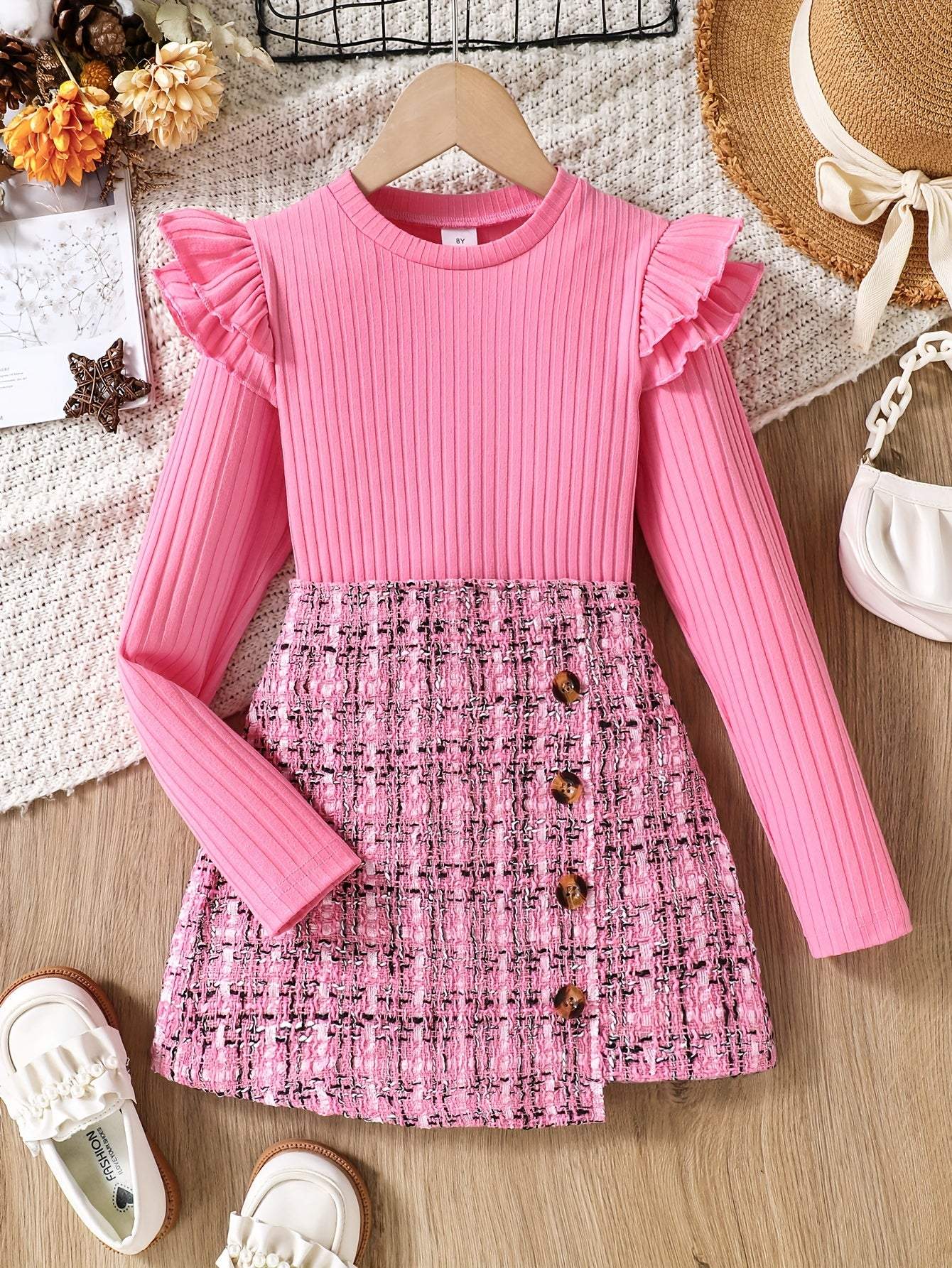 2-piece set with flounce trim long sleeve top and tweed knit skirt on display.