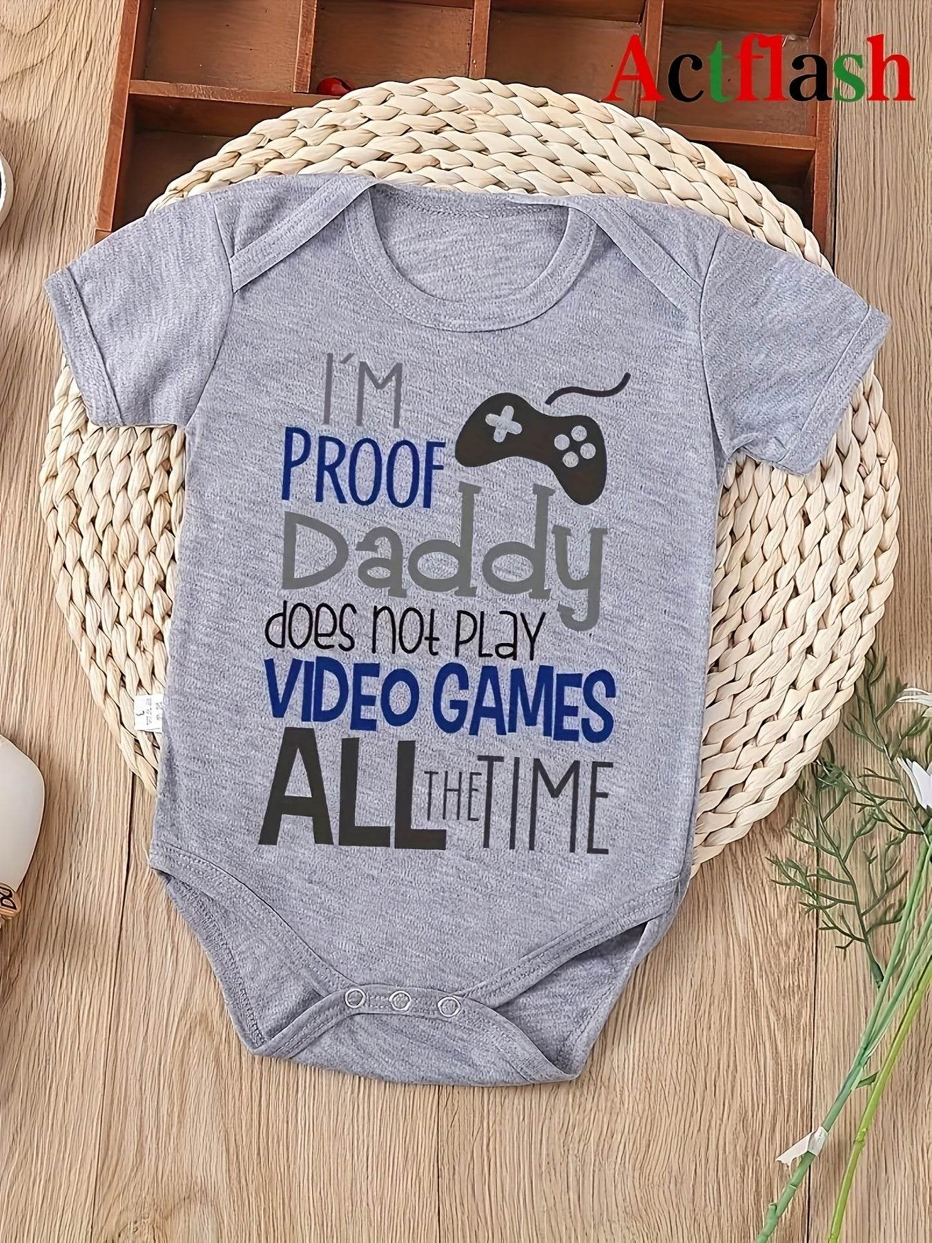 Baby romper with "I'm Proof Daddy Does Not Play Video Games All the Time" print, gray color, playful design.