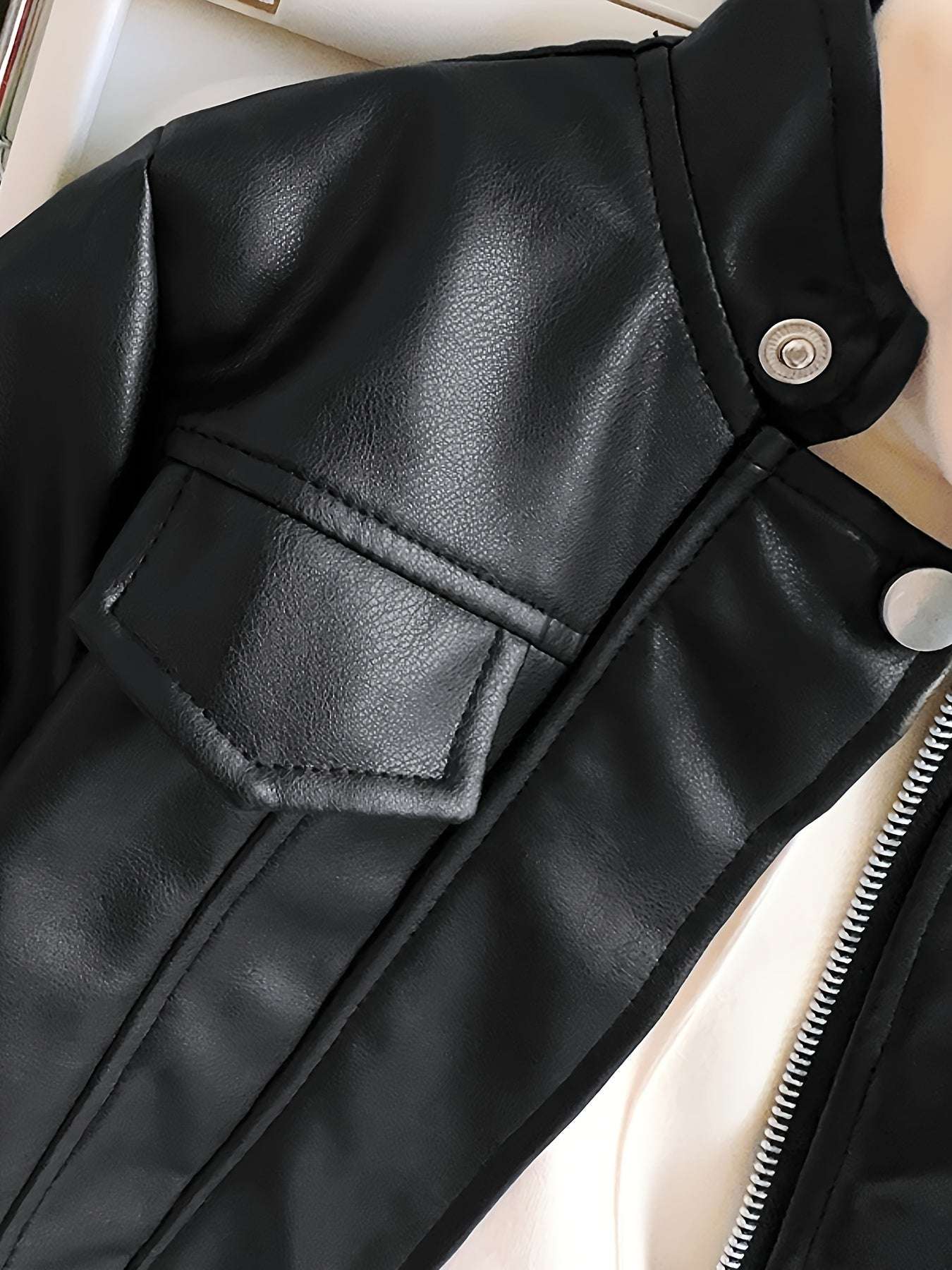 Trendy leather jacket for girls with button detail and zipper closure.