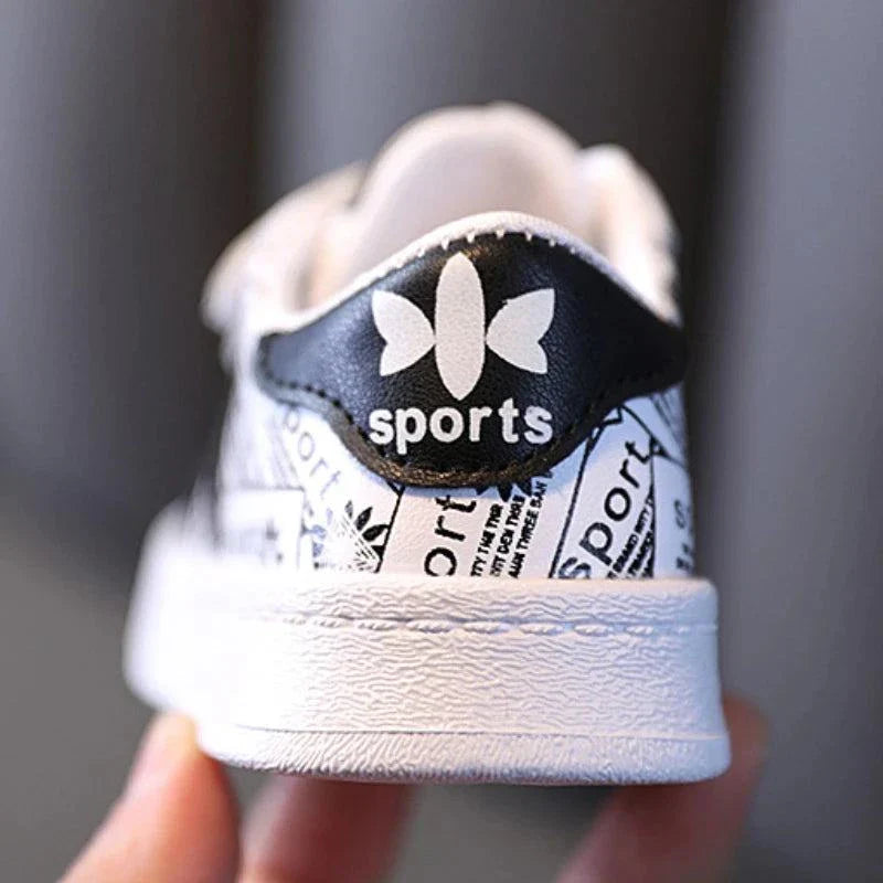 Playful safety anti-slip kids' shoes with durable leather, excellent traction, and trendy geometric pattern.