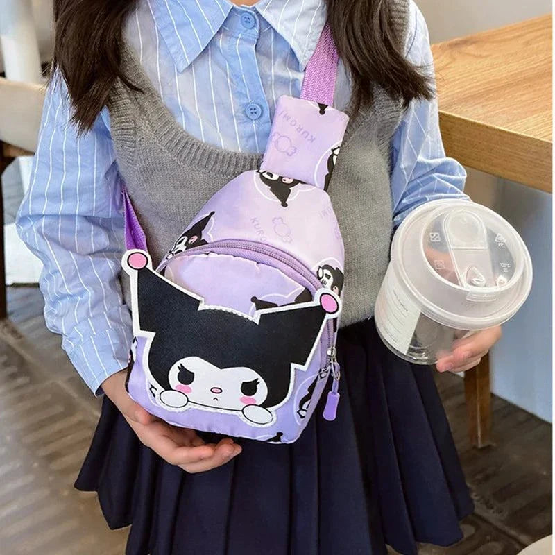 Child holding a purple Hello Kitty bag with cartoon design and adjustable straps.