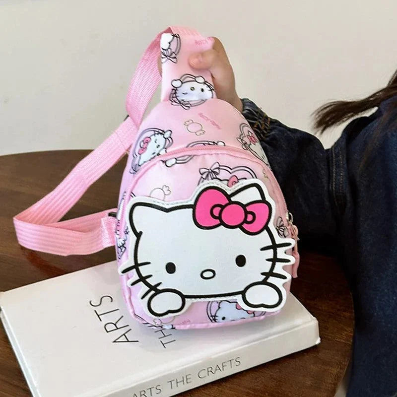 Hello Kitty bag with pink canvas, adorable graphics, and adjustable straps, perfect for kids.