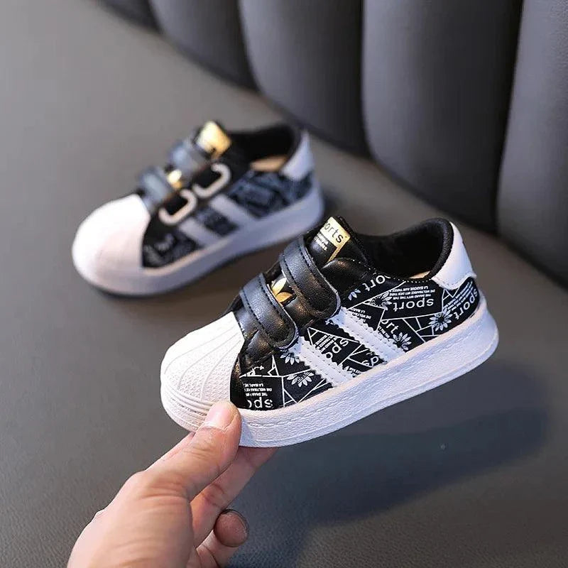 Playful Safety: Anti-slip kids' shoes with durable leather upper and geometric pattern for energetic adventures.