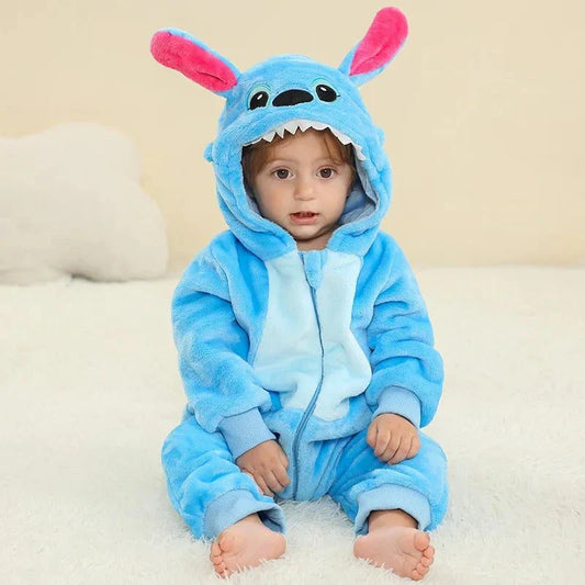 Baby wearing a blue jumpsuit with an animal theme, suitable for Children's Day celebrations.