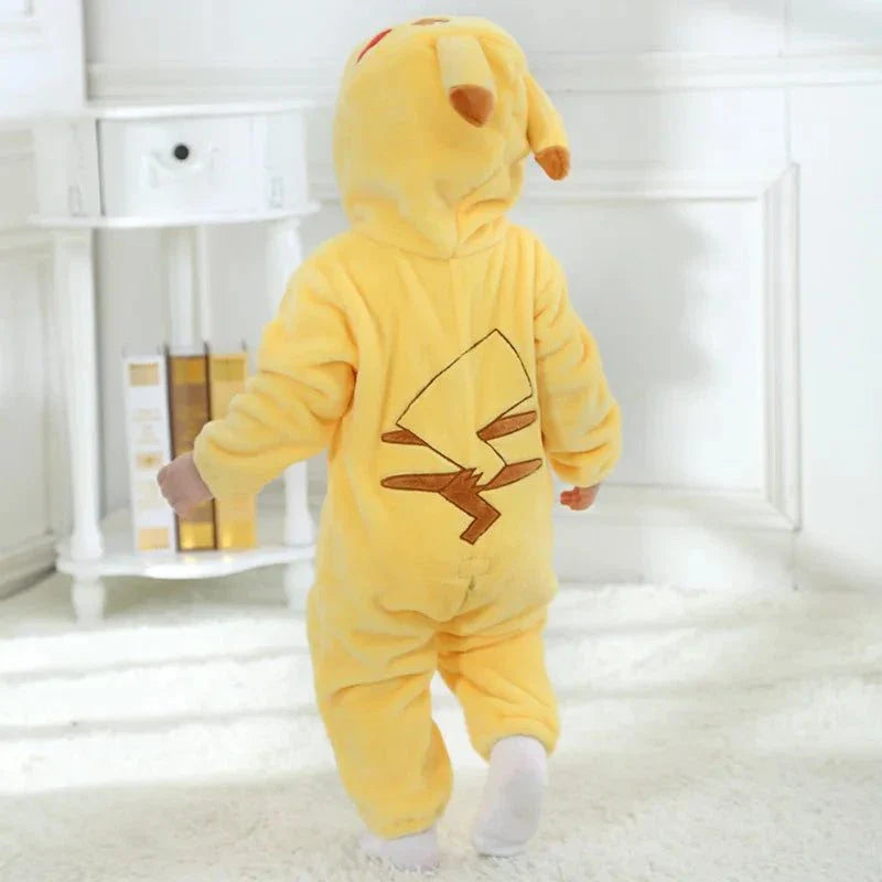 Toddler wearing a yellow Pikachu-themed Pokemon costume indoors.