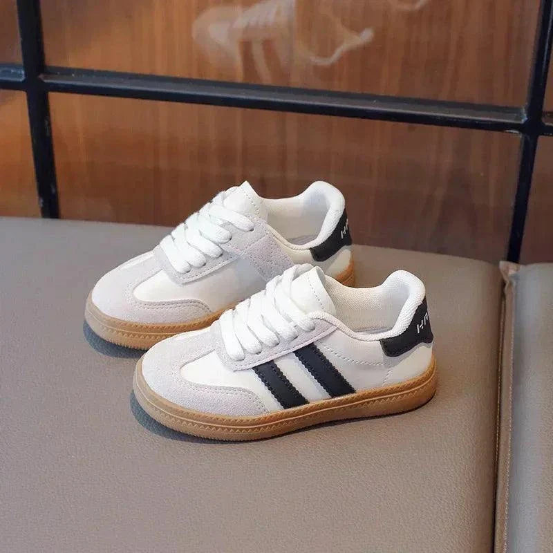 Trendy unisex sneakers for kids with durable PU leather and excellent grip.