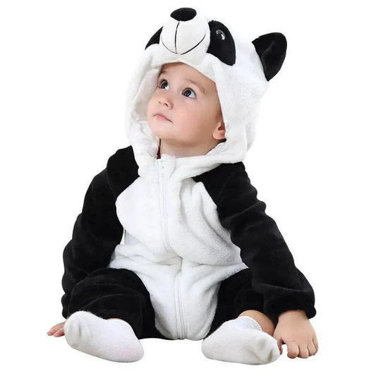 Adorable baby in penguin-themed jumpsuit for Children's Day celebration.