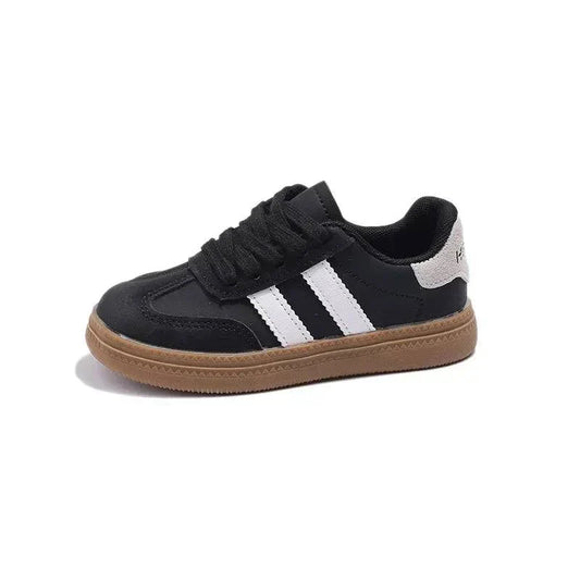 Trendy unisex kids' sneakers with black and white design for all-day comfort.