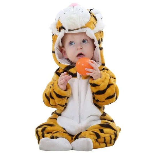 Baby in animal-themed jumpsuit holding orange ball.