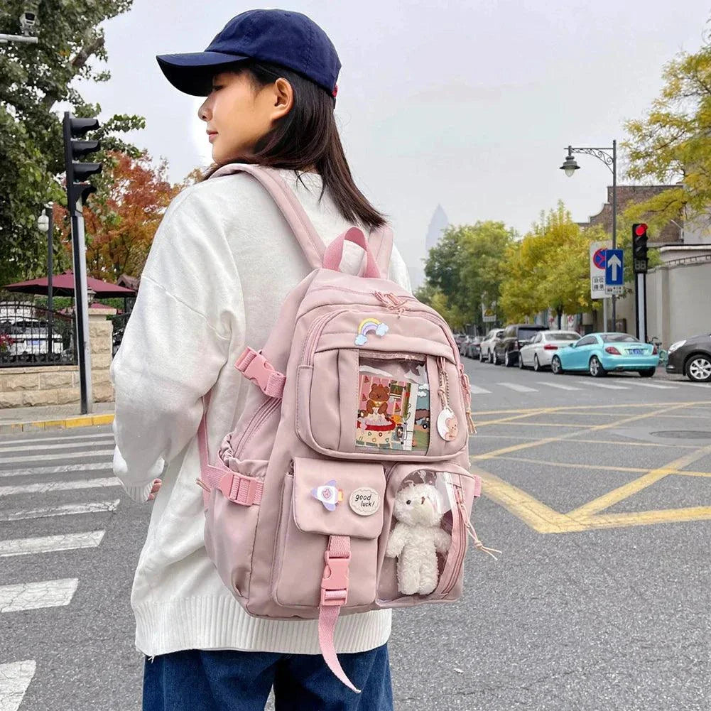 Children's pink schoolbag with a trendy design, featuring multiple pockets, an anti-slip design, and comfortable fit.