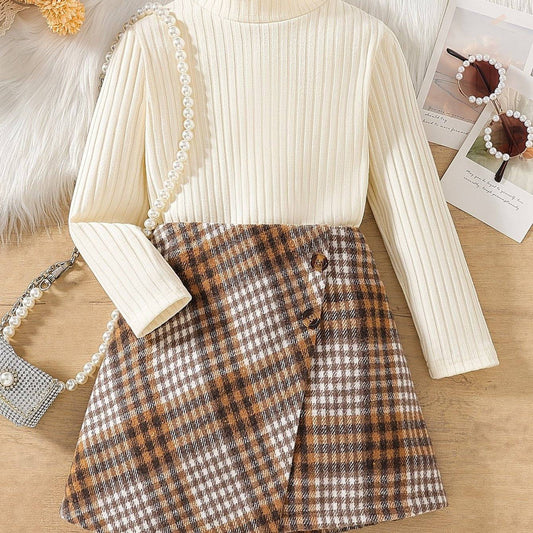 Stylish two-piece set with chic checkered skirt and cream ribbed top on display.
