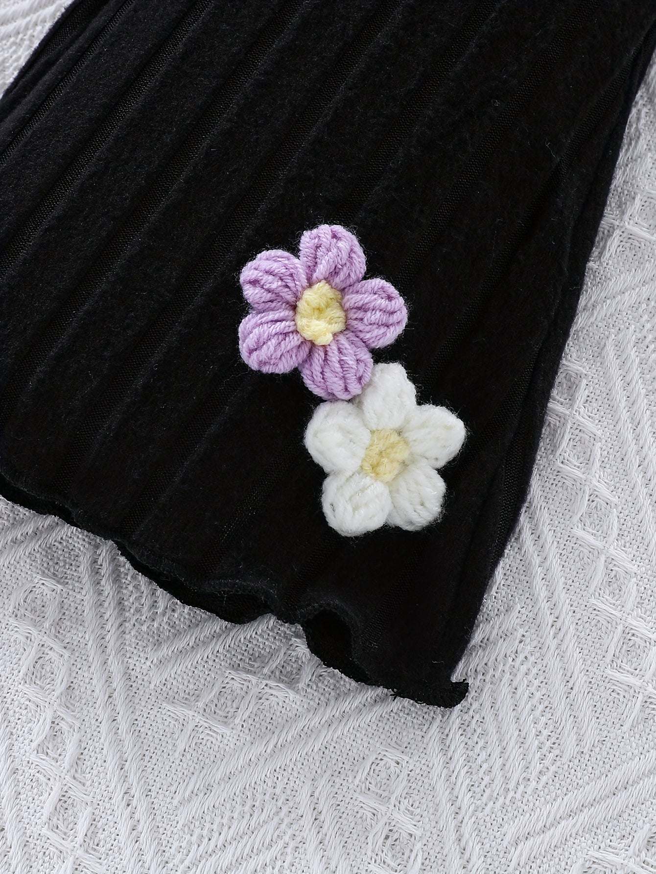 Elegant girls' outfit with floral details, fine knit fabric for a stylish look.