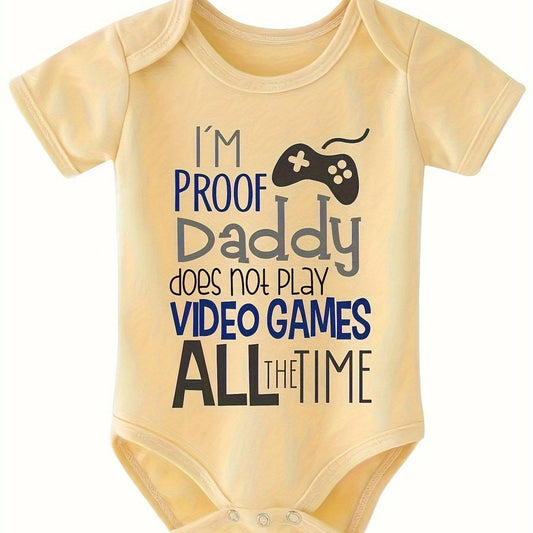 Infant romper with playful message "I'm Proof Daddy Does Not Play Video Games" in cartoon design.