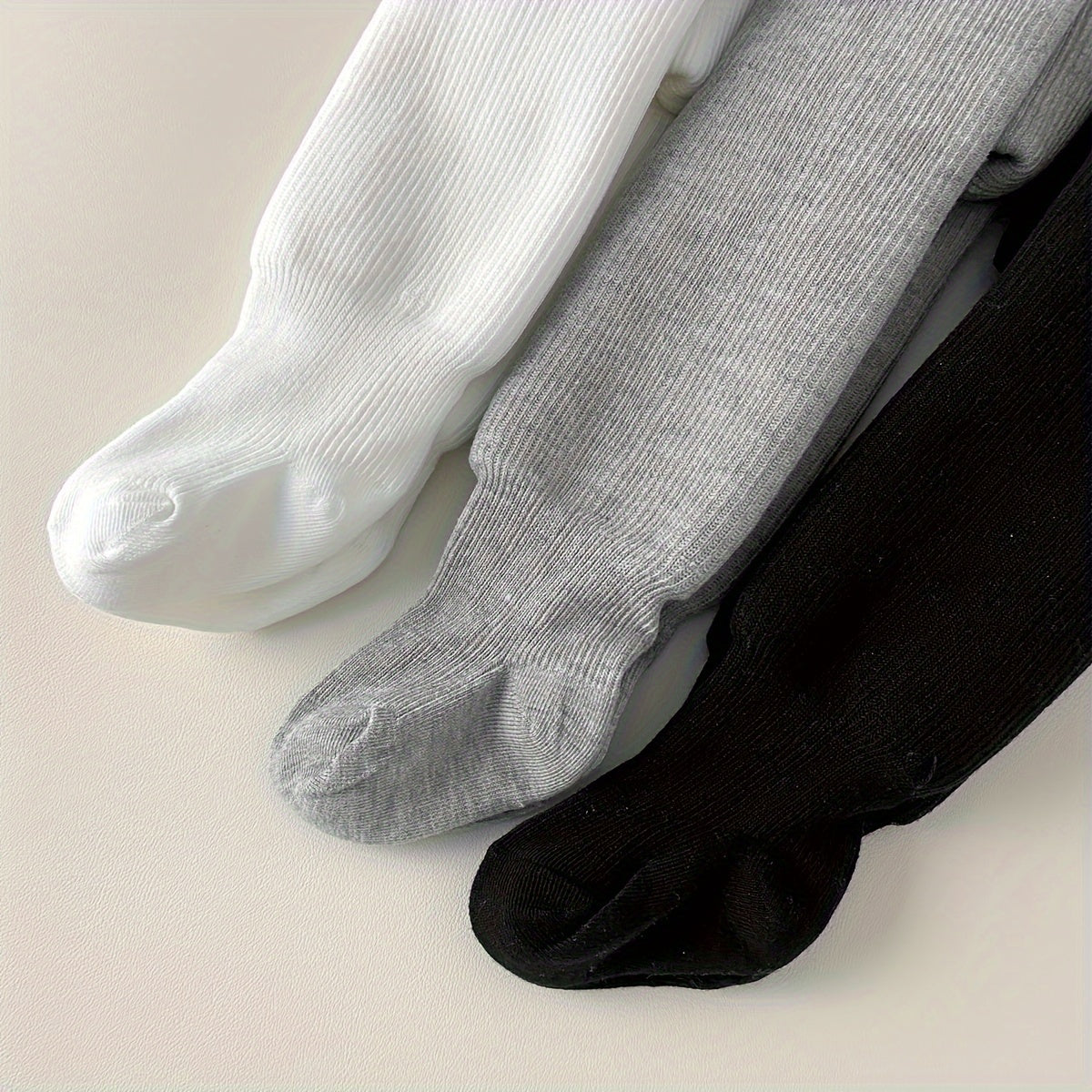 Cozy and warm girls' fleece-lined tights in solid colors for winter wear.