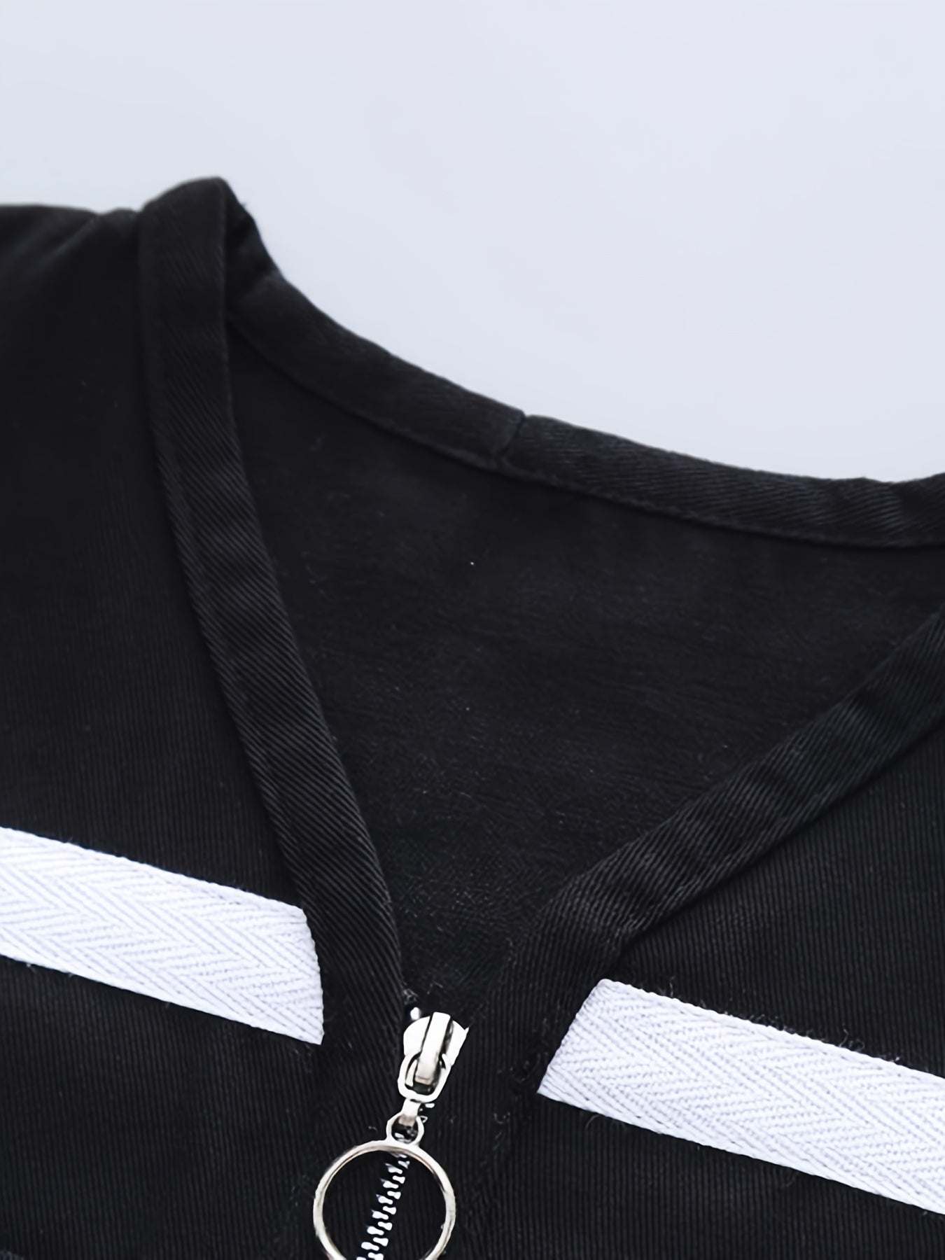 Close-up view of trendy boys' three-piece set with bold design in high-quality cotton.