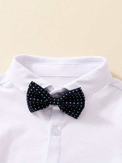 White shirt with a black polka dot bow tie, part of the Dapper Gentleman 3-Piece Suit Set for Boys.