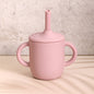 Easy grip double handled silicone cup for kids' independence in pastel pink color.