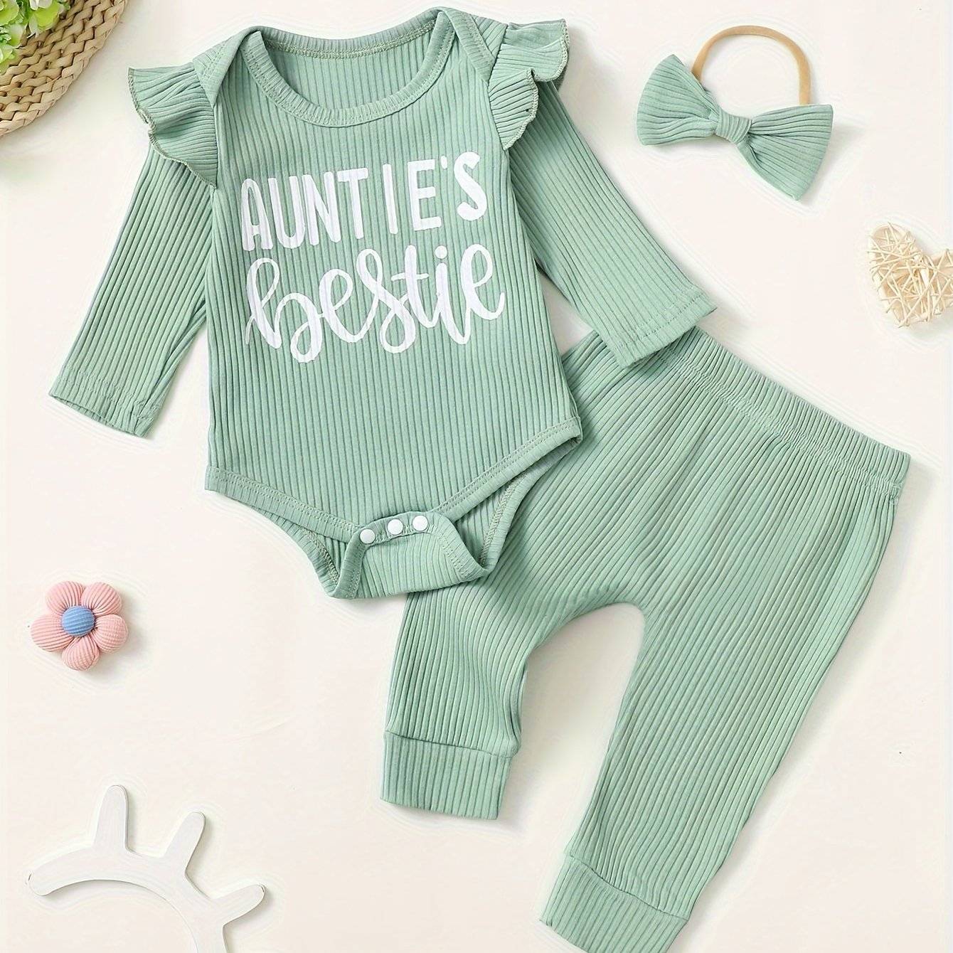 Cute baby outfit set with "Auntie's Bestie" print, featuring soft cotton fabric and a matching bow.