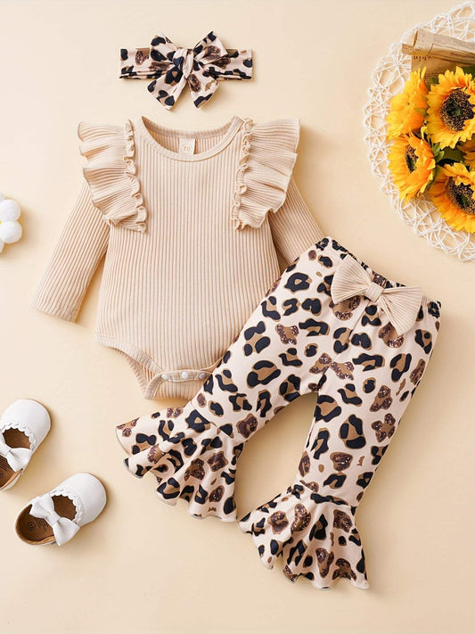 Adorable baby girl outfit with ruffled top and leopard print pants, perfect for playtime comfort.