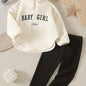 Stylish baby girl outfit set with cozy top and black pants for comfort and versatility.