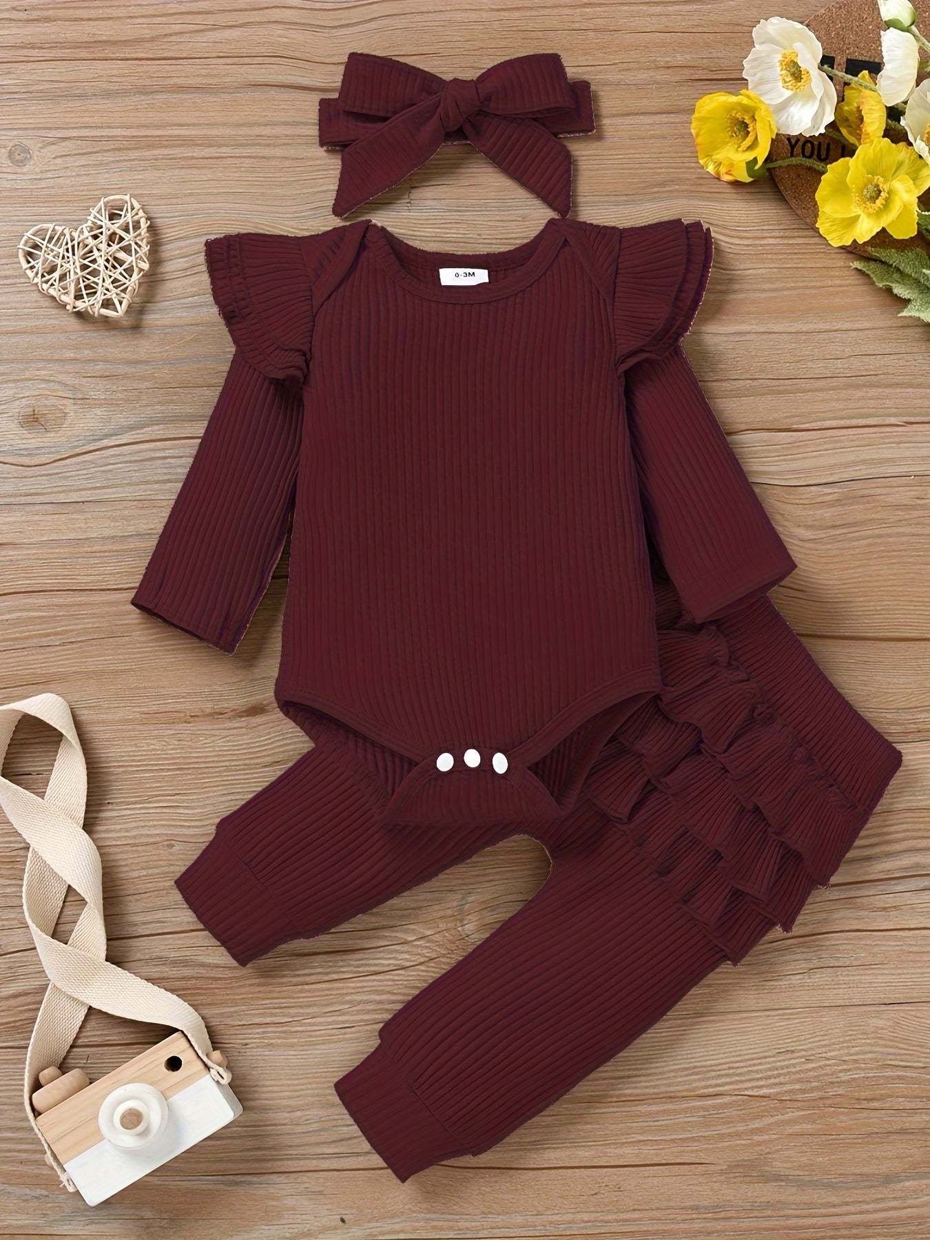 Charming 3-piece outfit set for girls with burgundy ruffled top, matching pants, and headband.