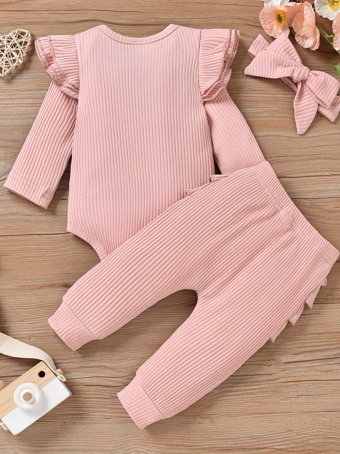 Charming Trio 3-piece pink outfit set with headband for girls, featuring ruffled long-sleeve top and matching pants.