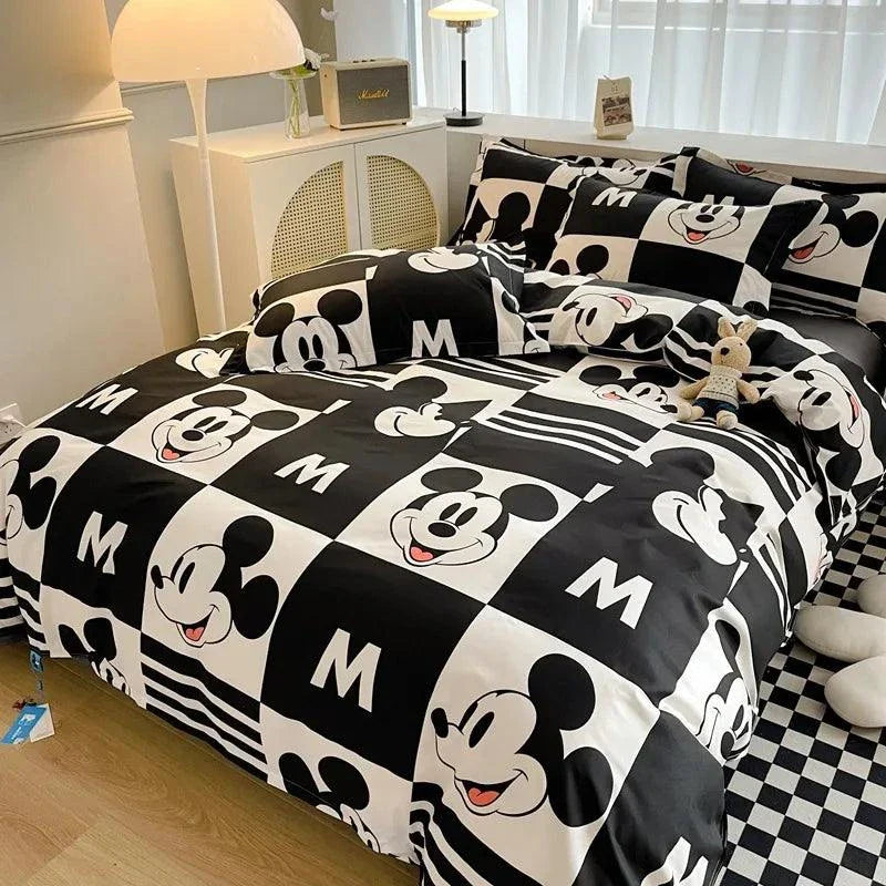 Disney 4-piece cotton bedding set with Mickey Mouse cartoon design on duvet cover, pillowcases, and flat sheet, ideal for a cozy bedroom atmosphere.