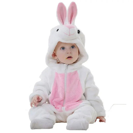 Cute baby wearing a white and pink bunny jumpsuit with floppy ears.