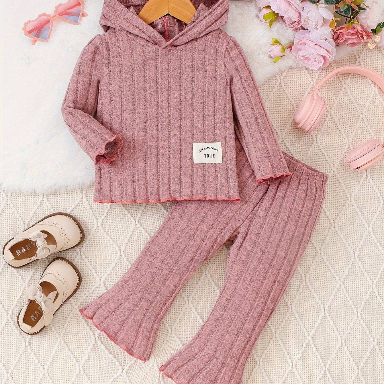 Pink 2-piece shirt and pants set for girls, soft ribbed fabric, stylish and comfortable.