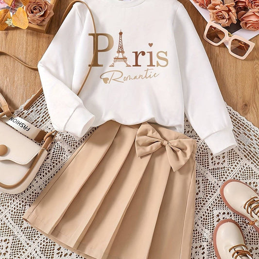 Chic girls' outfit set with Paris design, featuring a white sweatshirt and pleated skirt.