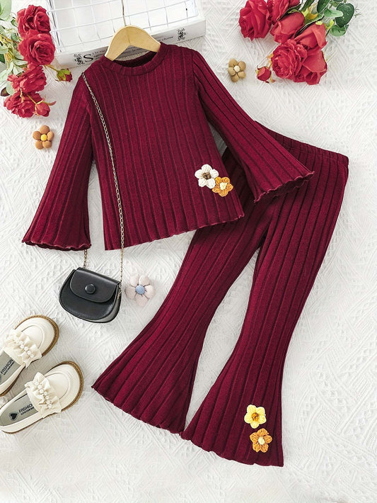 Stylish girls' outfit set in deep red with floral accents and ribbed texture.