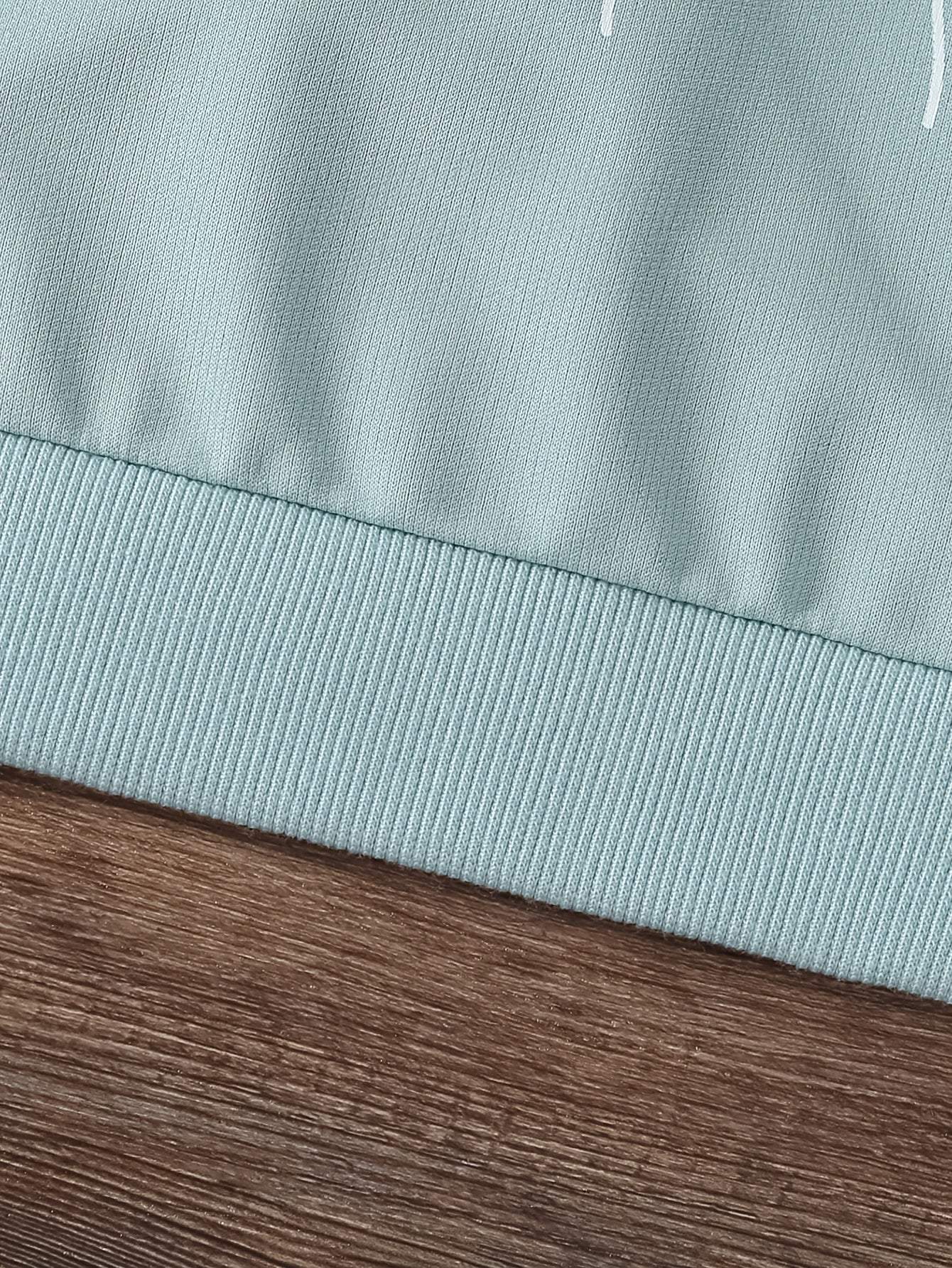 Close-up of the ribbed hem of a trendy two-piece set for girls, showcasing the high-quality knit fabric.