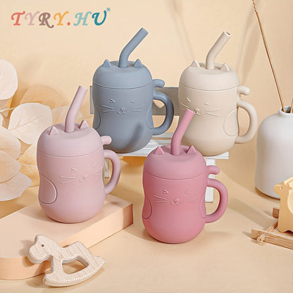 Kawaii cat learning cups for babies in grey, beige, and pink with straws and handles.