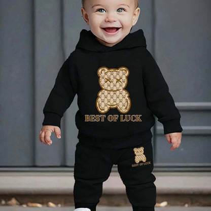 Toddler wearing Playful Paws Cozy Bear Print Sweatshirt and Pants Set with whimsical bear design.