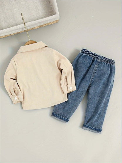 Casual chic denim pants with stylish beige shirt outfit on hanger.